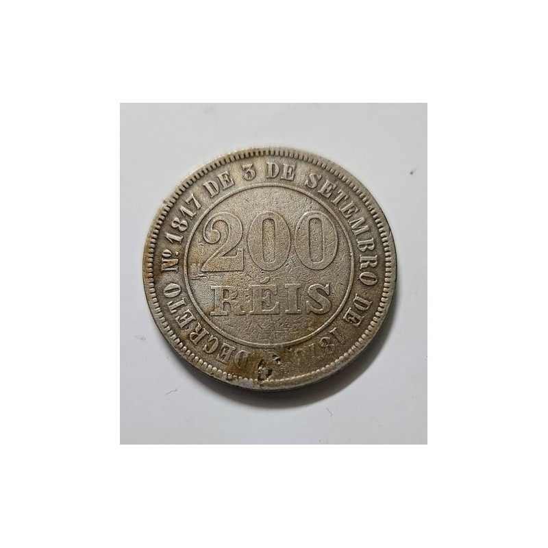 Adquira esta histórica moeda de 200 Réis do Império do Brasil, ano 1877. Uma autêntica peça em bronze-níquel, perfeita para cole