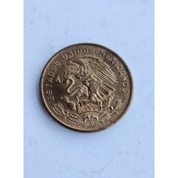 Venda de moeda de 20 centavos do México, ano de 1965. Apresenta a Pirâmide da Lua em Teotihuacán e a águia mexicana. Item de col